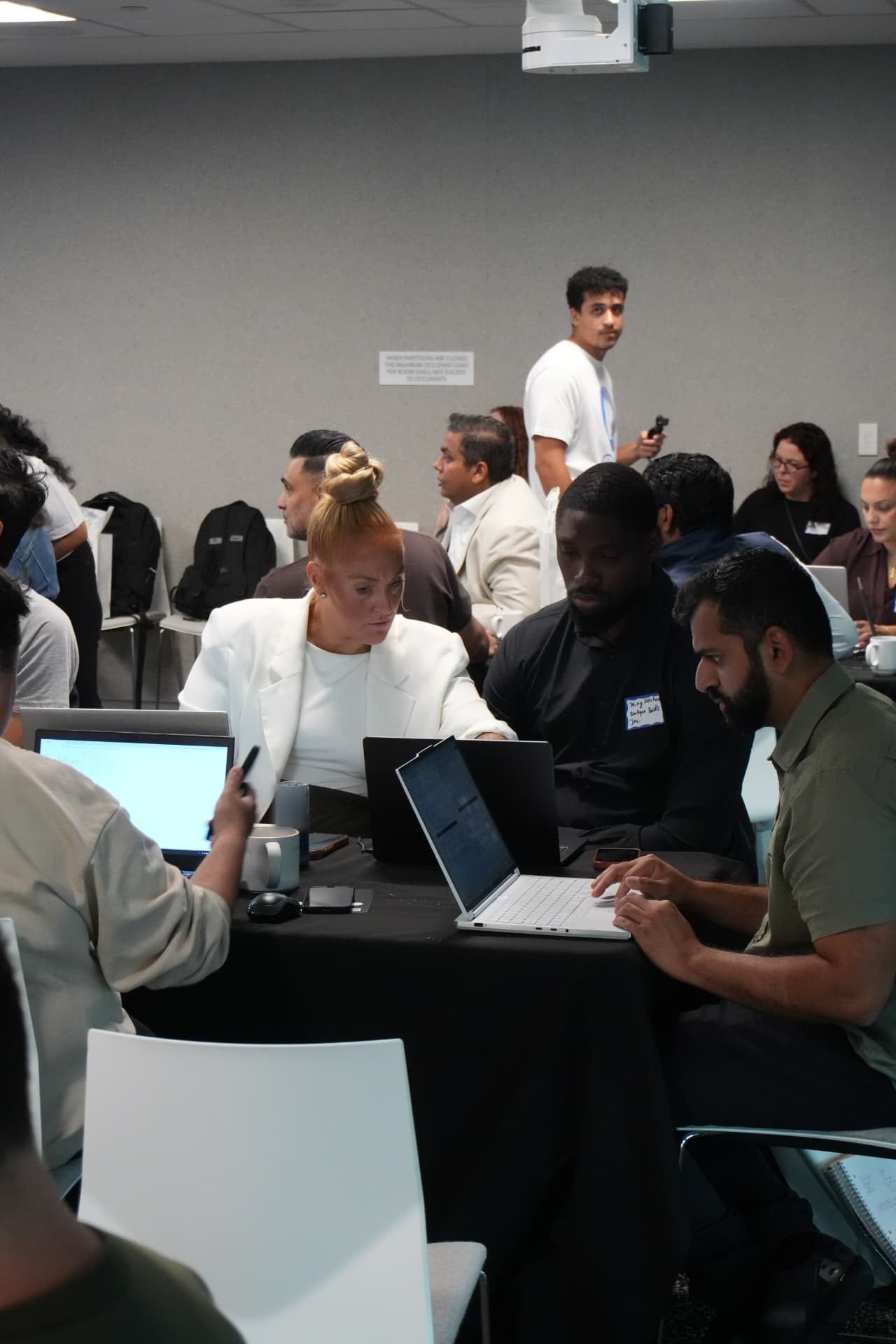 Accountants working together on laptops at the Toronto workshop